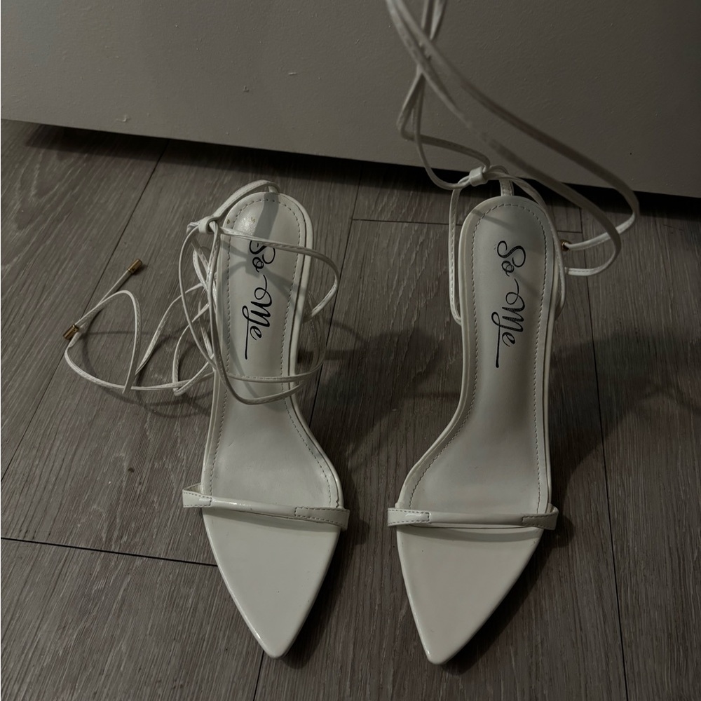 White heels with long tie straps. Size 7.